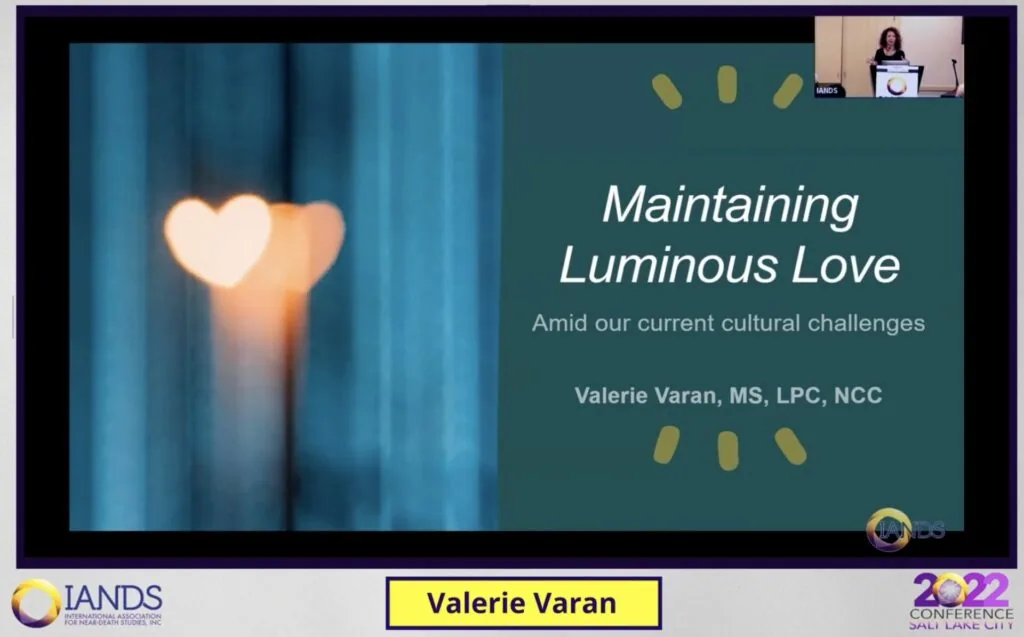 Conference presentation slide showing a heart-shaped candle flame with title 'Maintaining Luminous Love' by Valerie Varan, MS, LPC, NCC