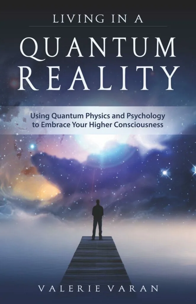 Book cover showing a silhouetted figure standing on a wooden dock overlooking a starry sky with nebulae and cosmic light. Title reads Living in a Quantum Reality with subtitle Using Quantum Physics and Psychology to Embrace Your Higher Consciousness. Author name Valerie Varan at bottom.